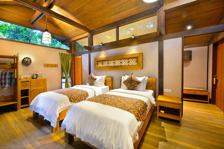 Mid-range lodge twin room interior with a river view