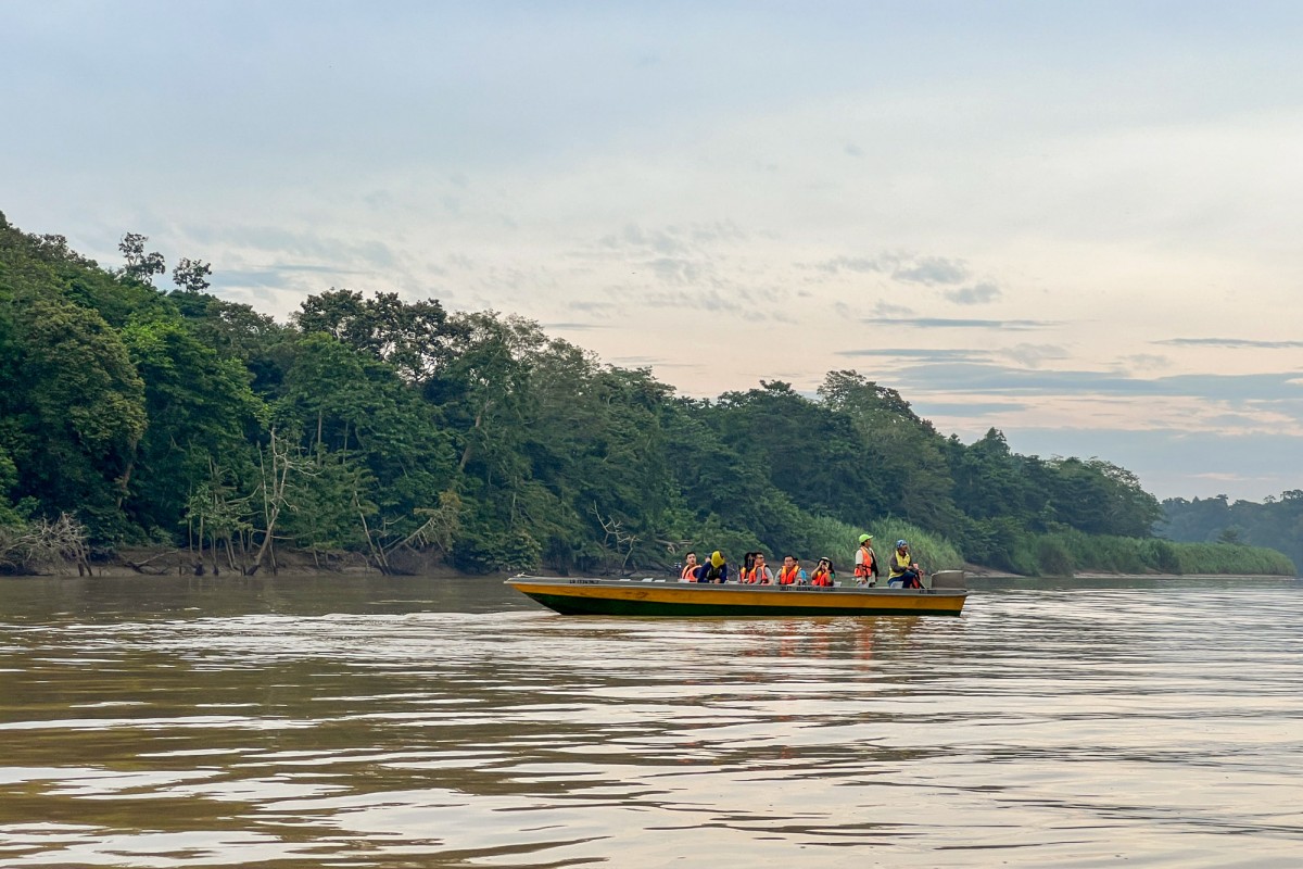 River cruise boat in golden light on a Sabah wildlife river