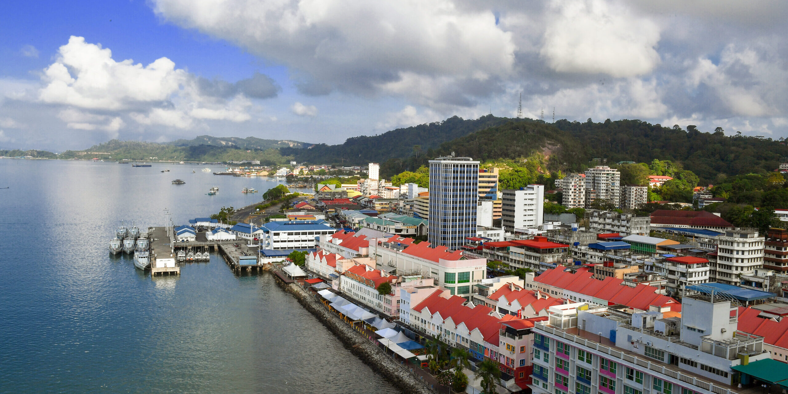 Sandakan waterfront with fishing boats and stilt houses