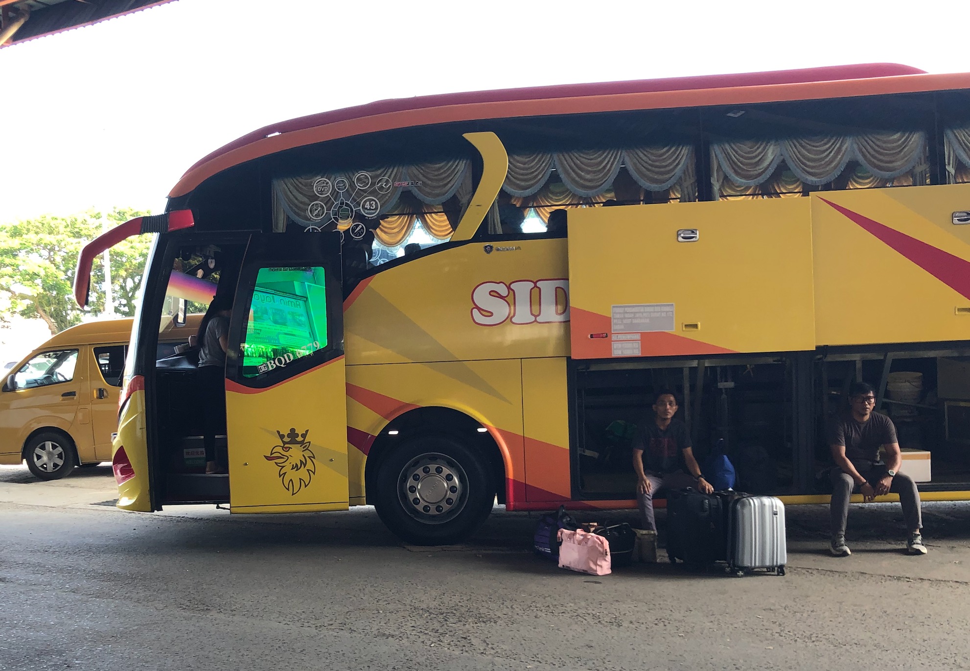 Sandakan waterfront or the minibus terminal with a Batu 14 bus loading
