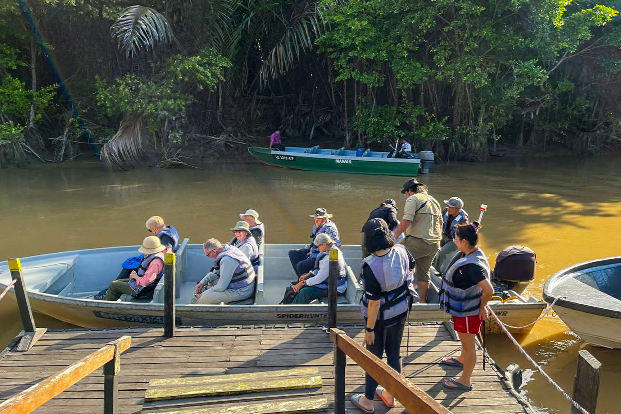 Boat transfer approaching Abai on the lower Kinabatangan